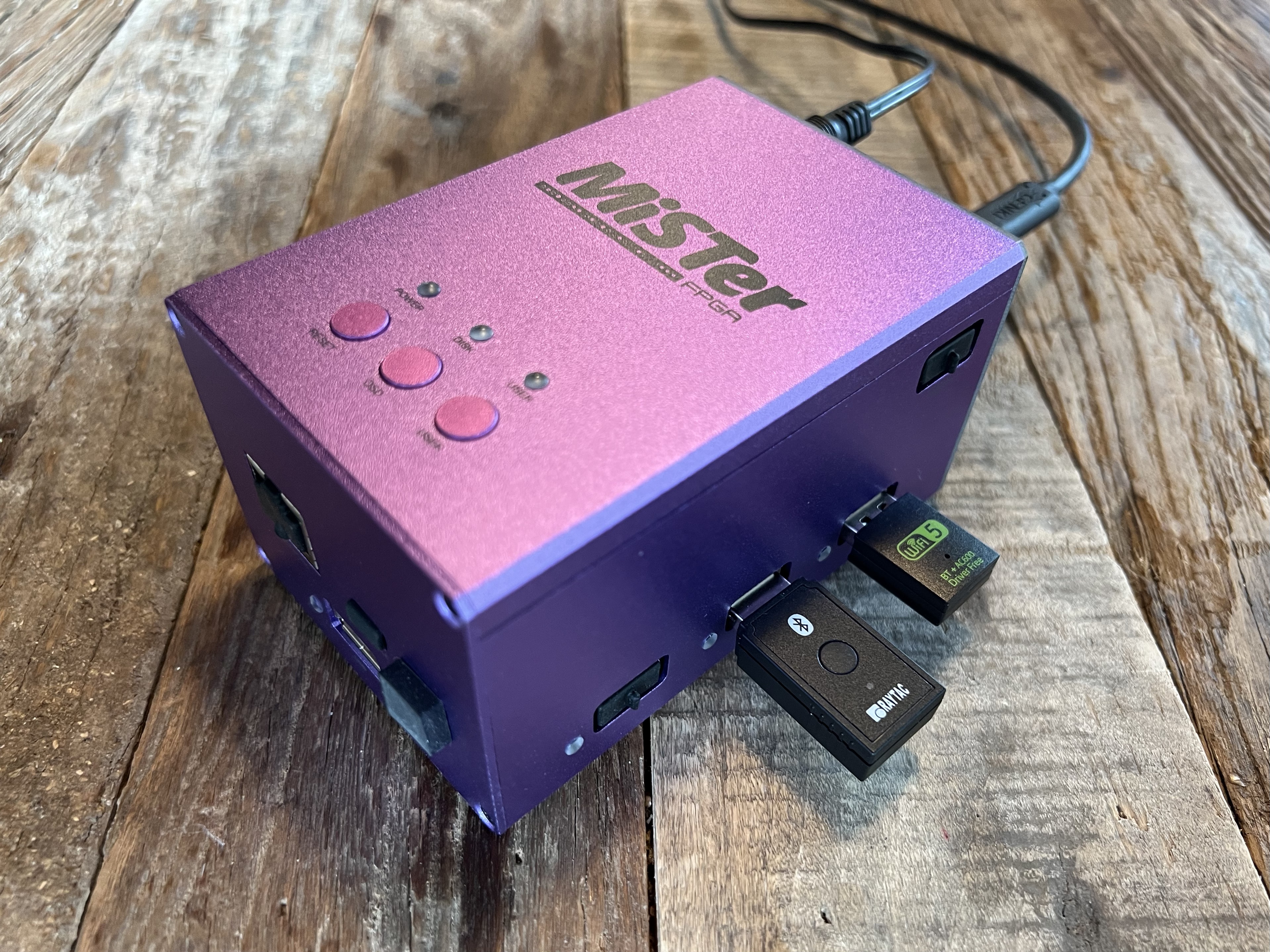 Photo of an TinyBoard plugged into a MiSTer